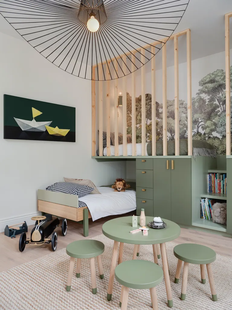 a kids bedroom with a forest mural