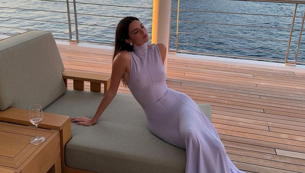 Kendall Jenner wears a semi sheer high neck dress on a yacht in spain