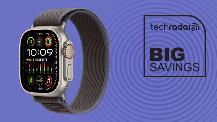 Apple Watch Ultra 2 with blue and black trail loop band on purple background with black TechRadar big savings icon