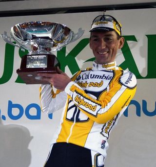 Marco Pinotti shows off the trophy