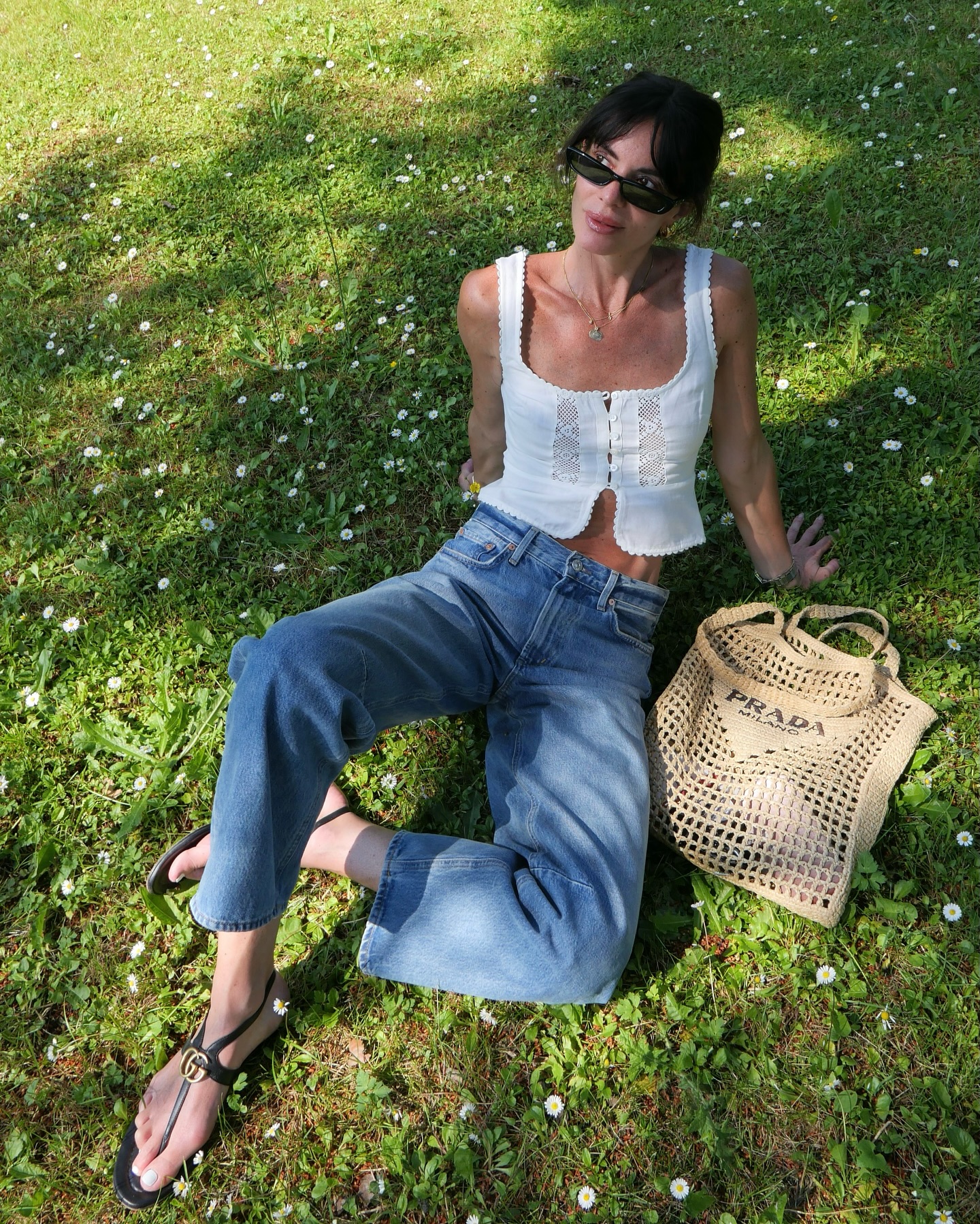 Hedvig Sagfjord Opshaug wears a broderie anglais vest, blue jeans and Gucci sandals.