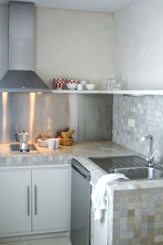 Grey kitchen with tiled kitchen countertops