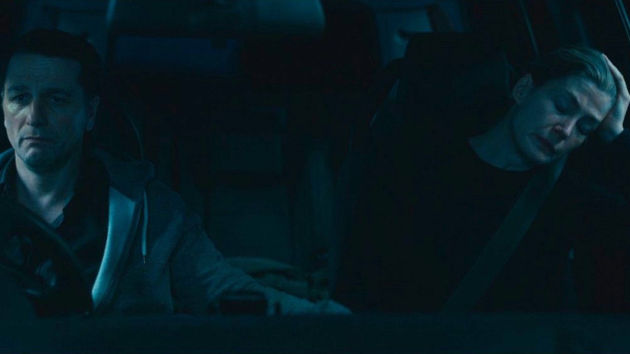 Matthew Rhys holding Rosamund Pike's hand in Hallow Road.