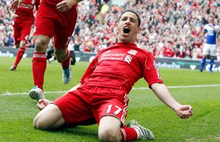 Maxi Rodriguez celebrates with a knee-slide after scoring for Liverpool against Birmingham City, 2011