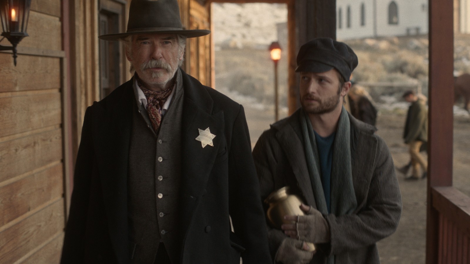 Pierce Brosnan and Brandon Lessard in The Unholy Trinity