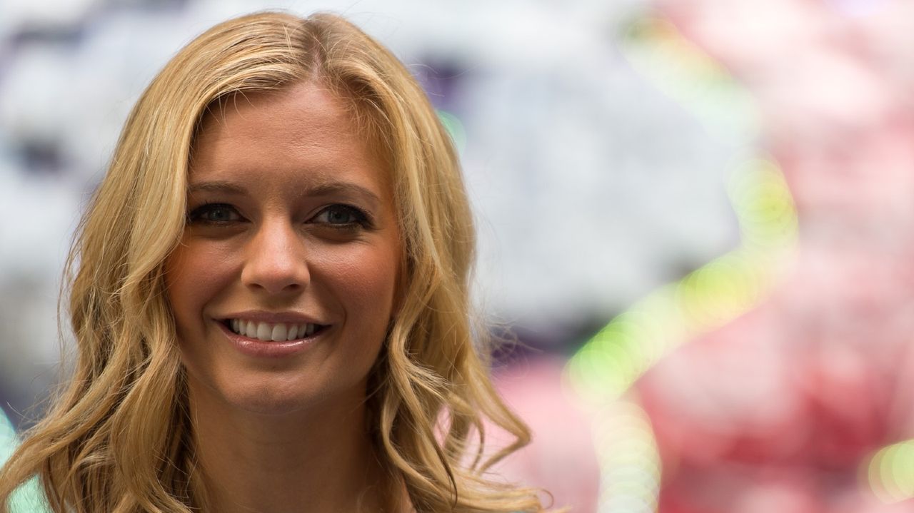 Rachel Riley poses next to a giant brain made of fresh British berries to promote the fact that berries could help to improve memory and concentration at New Street Square on July 28, 2016 in London, England.