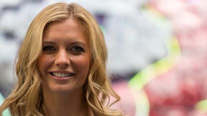 Rachel Riley poses next to a giant brain made of fresh British berries to promote the fact that berries could help to improve memory and concentration at New Street Square on July 28, 2016 in London, England.