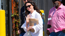 A picture of Anna Hathawat in a white shirt and sunglasses