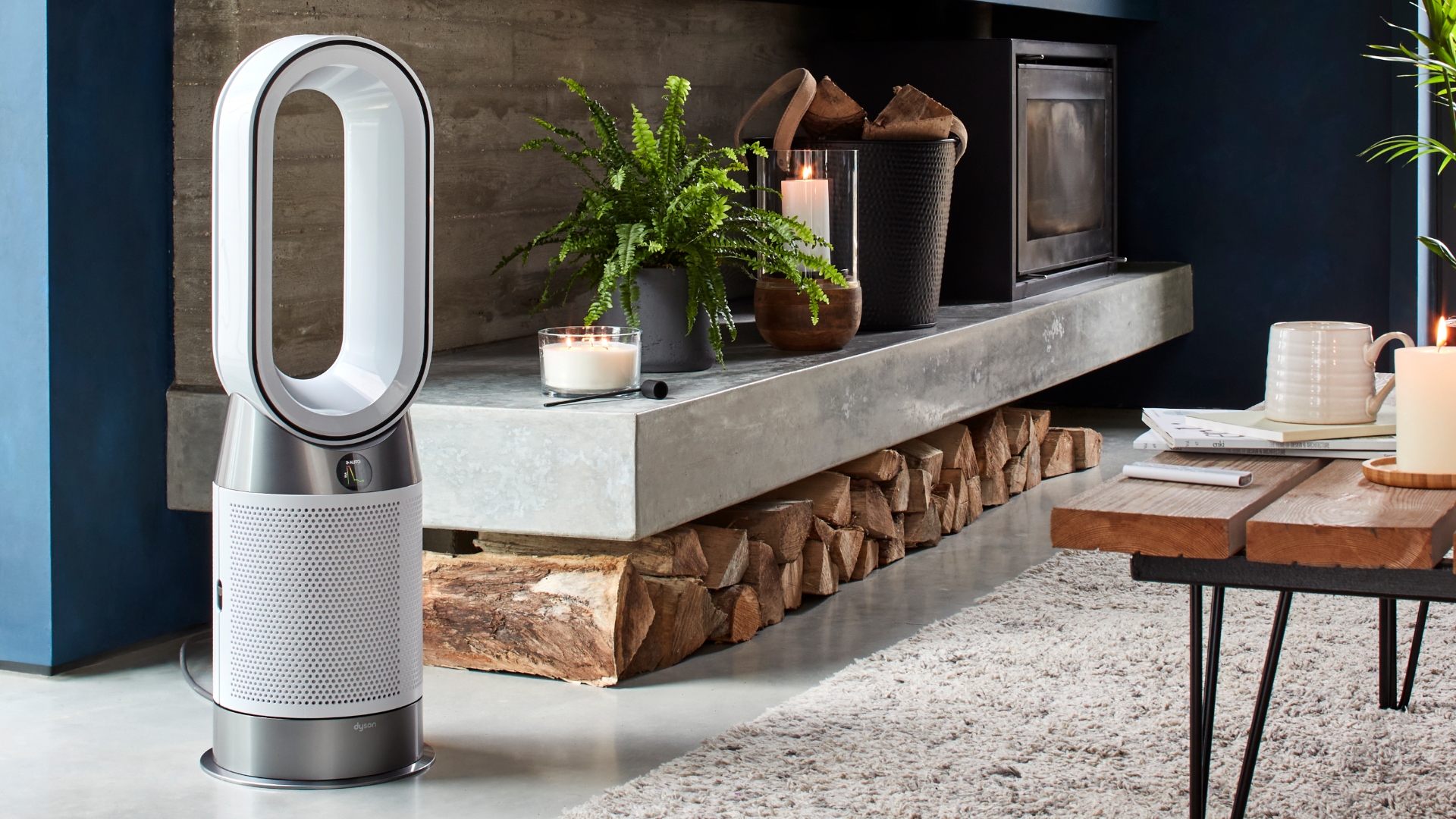 Dyson purifier hot and cool by a fireplace