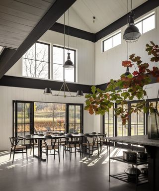 A double-height kitchen and dining area in a historic barn conversion