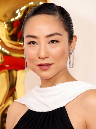 Greta Lee attends the 96th annual Academy Awards.