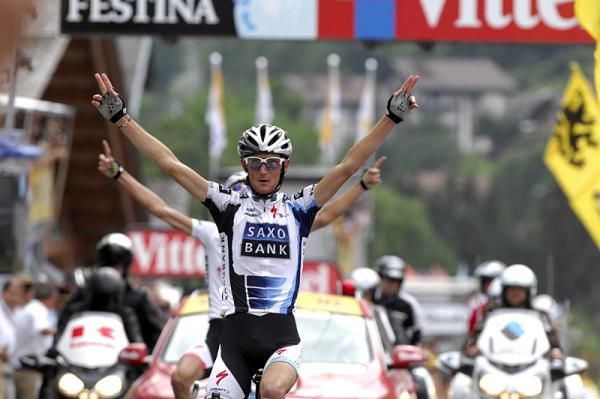 Two pairs of Schleck arms are raised in victory at the finish in Le Grand-Bornand.