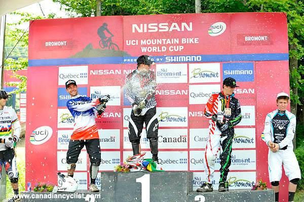 The top five riders get celebrations underway with some champagne.