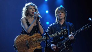 Taylor Swift and John Rzeznik onstage