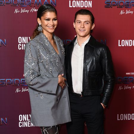 Zendaya and Tom Holland attend a photocall for 'Spiderman: No Way Home' at The Old Sessions House on December 05, 2021 in London, England