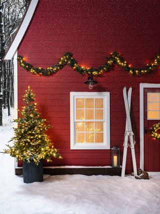 Outdoor Christmas tree with garland and wreath