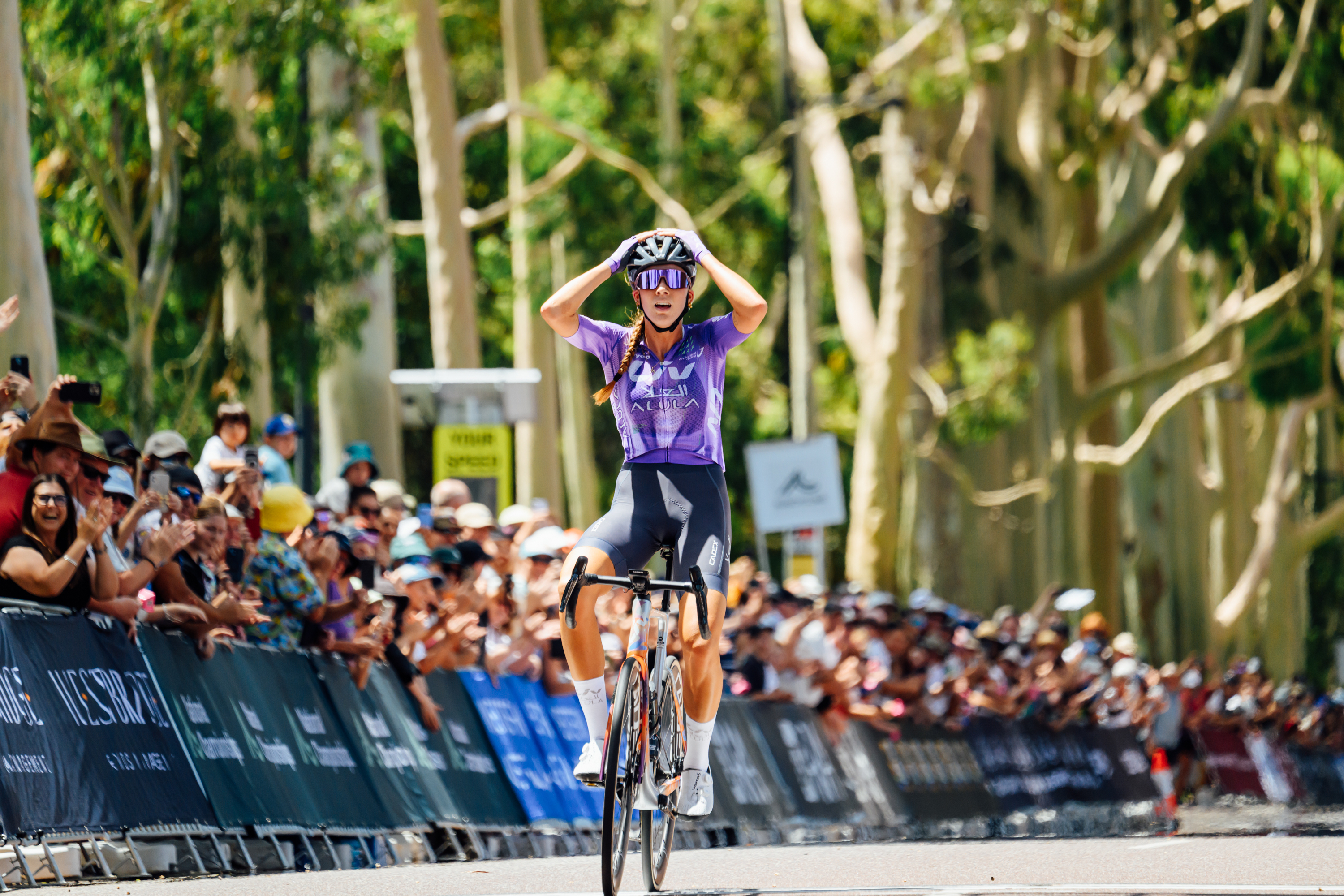 Mackenzie Coupland crossing the line to win the elite women's race at AusCycling Road National Championships