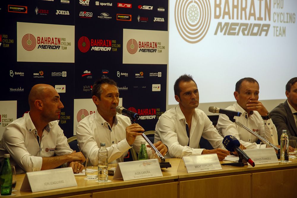 Team staff address the riders and media at the Bahrain Merida camp