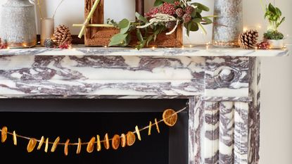 marble mantelpiece with dried orange slice decorations