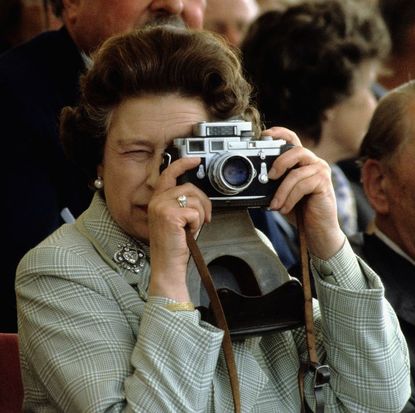 Queen Elizabeth snapping a picture