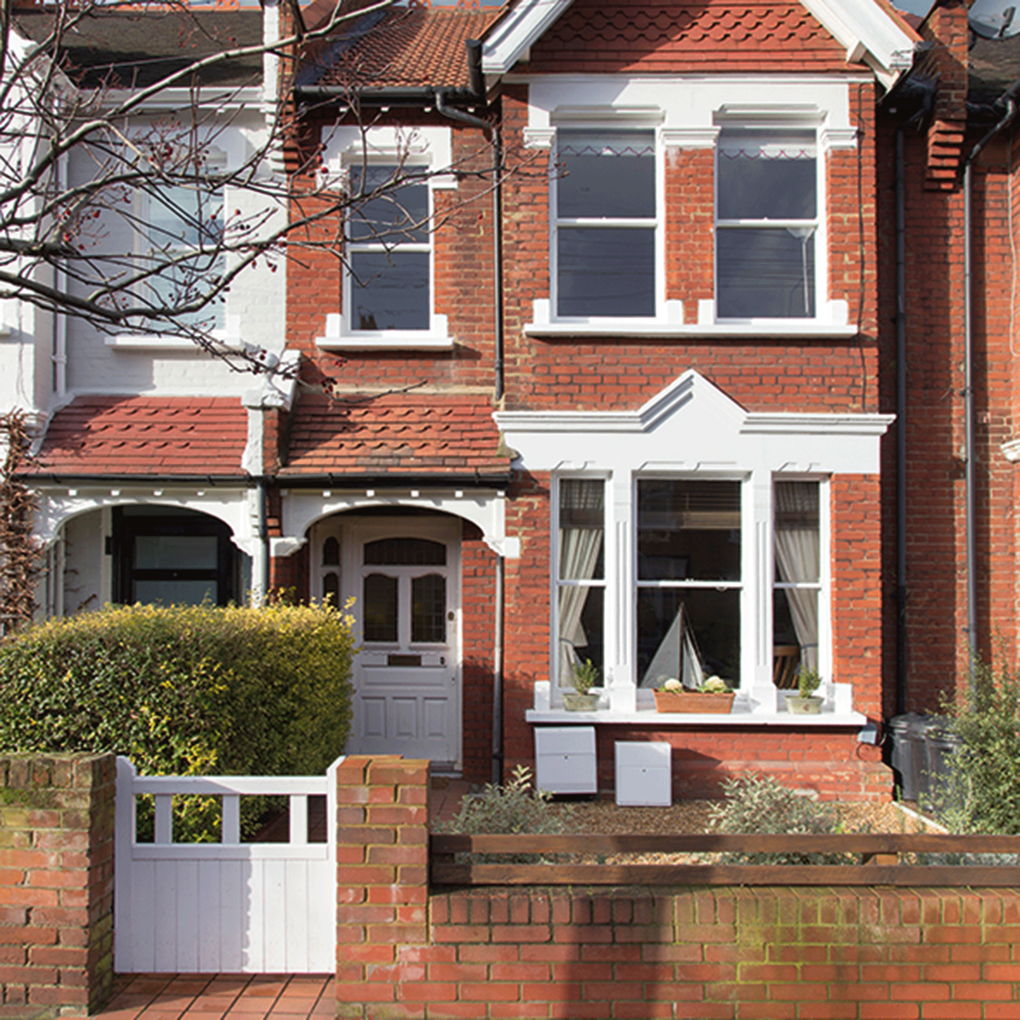 Red brick house with white trim
