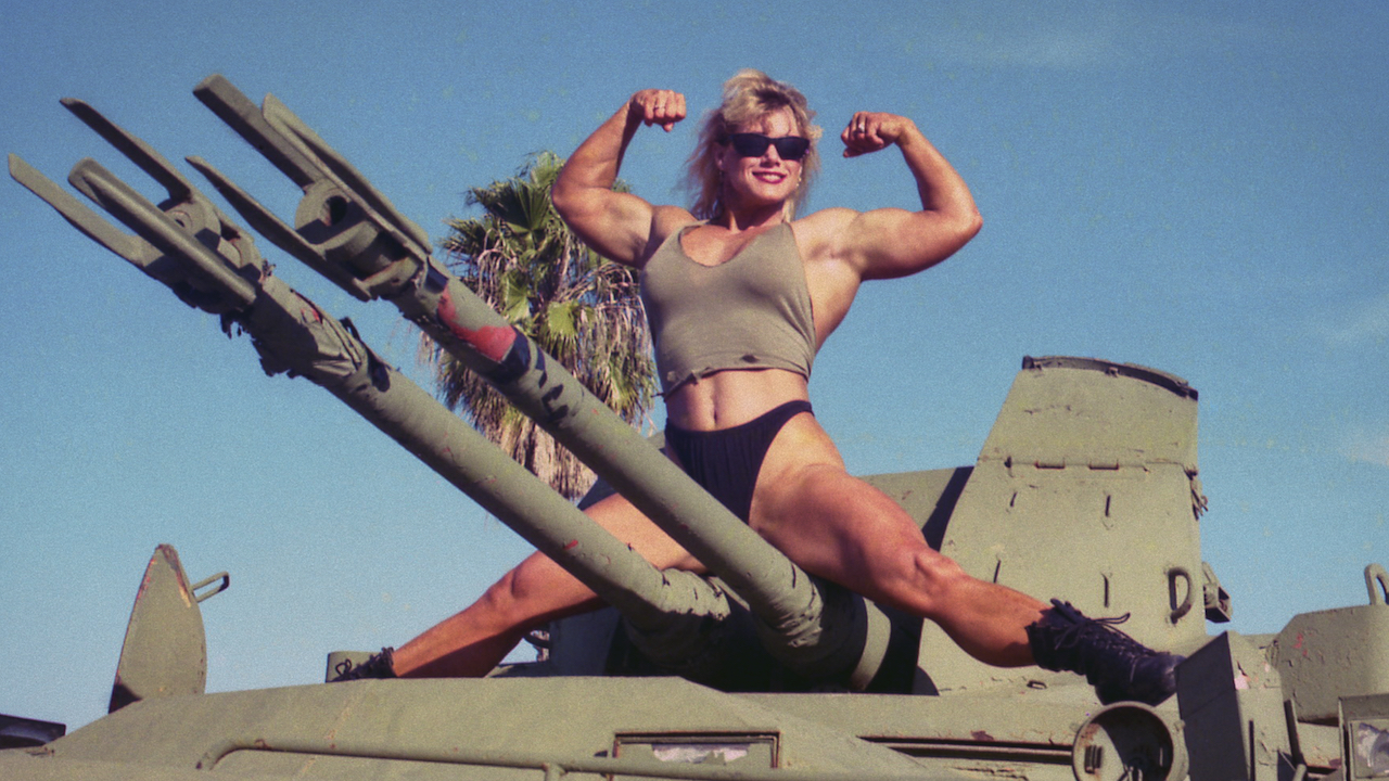 Sally McNeil posing on a tank in Killer Sally