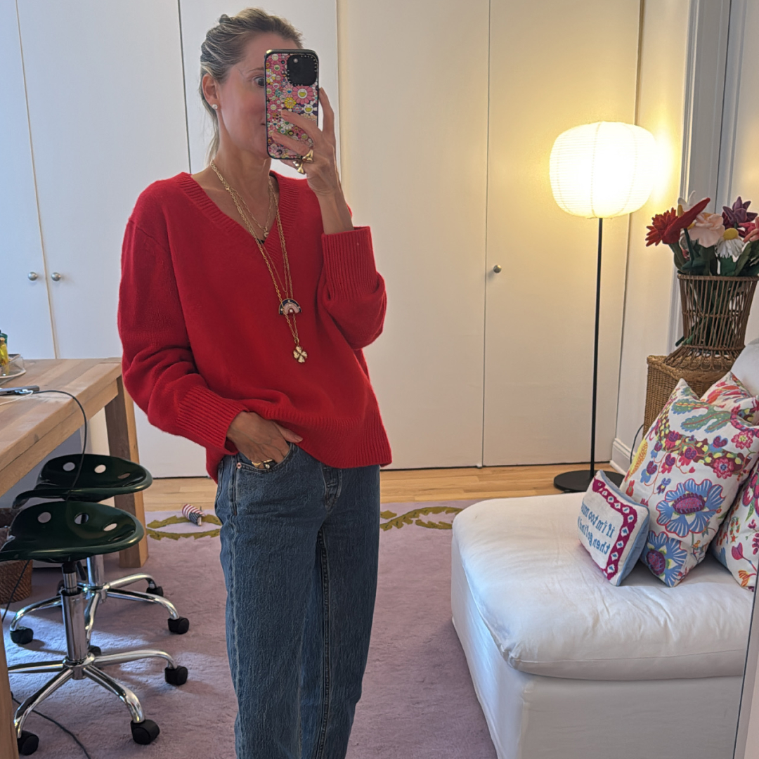 Marina Larroud&eacute; wearing a red sweater with jeans