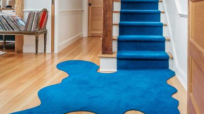 a blue stair runner with an abstract base