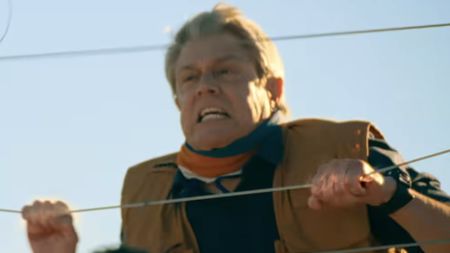 Johnny Knoxville grabbing an electric fence in Tiny Fugitives