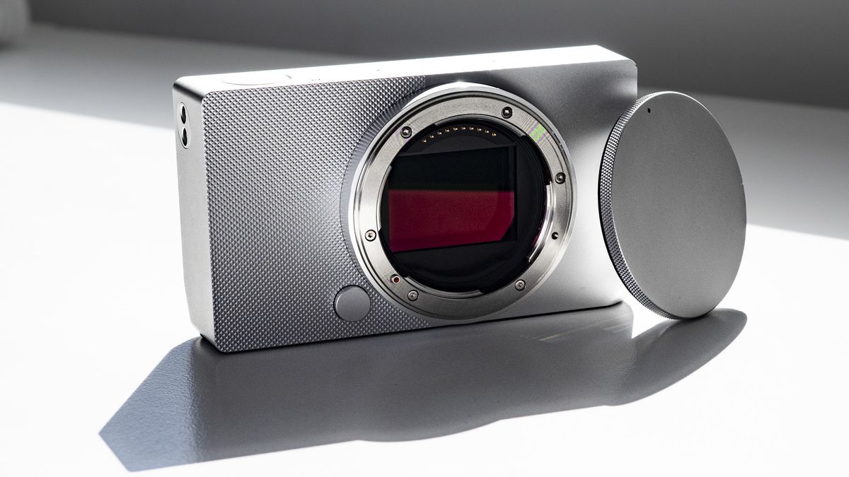 Sigma BF with its body cap, on a white surface in strong light, with defined shadows