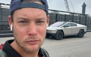 A selfie taken by Jason Kirton in front of a Cybertruck near the SpaceX launch site.