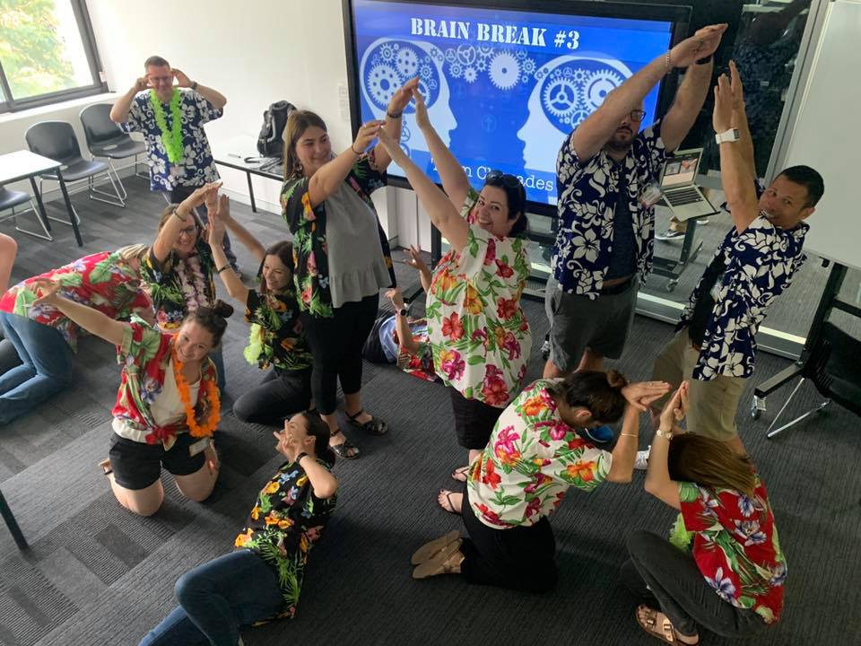 Teachers take a brain break with charades.