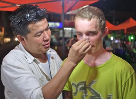 Avocado rub - Russell Finsterwald tries out the local beauty products, sort of willingly.