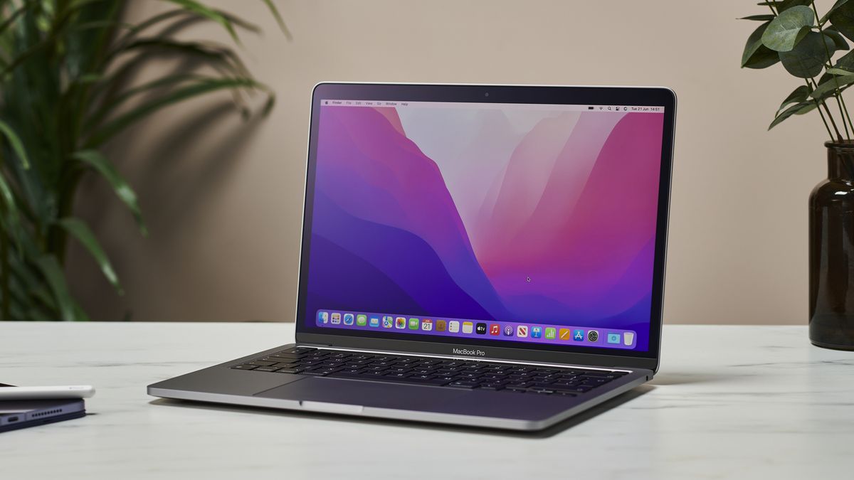 MacBook Pro 13-inch M2 model in an office on a desk