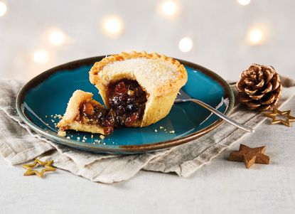 A mince pie on a blue plate