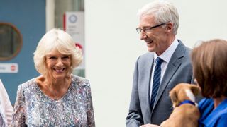 Camilla, Duchess of Cornwall chats to Paul O'Grady during a visit to Battersea Dogs & Cats Home on September 7, 2016 in London, England.