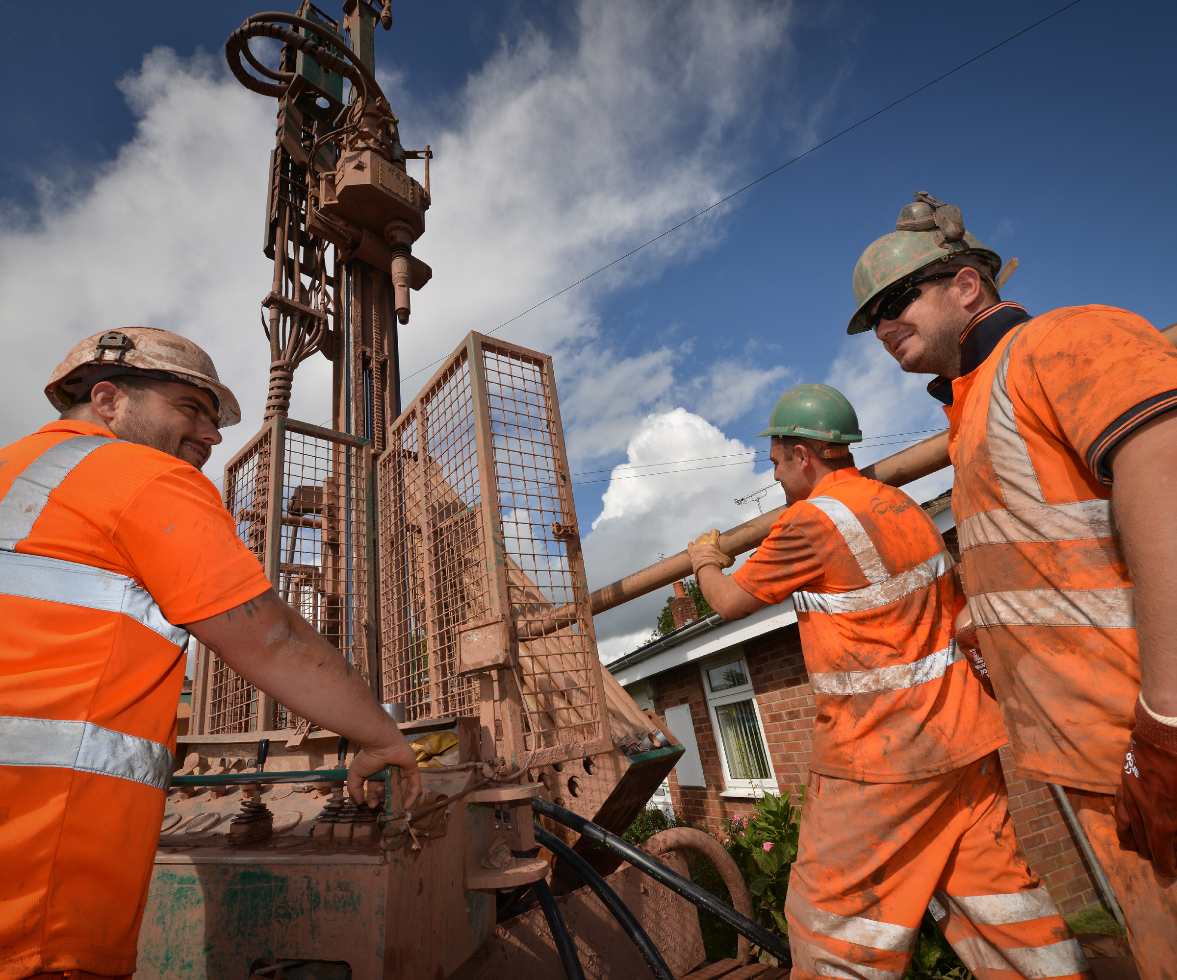 borehole machine and workmen in street