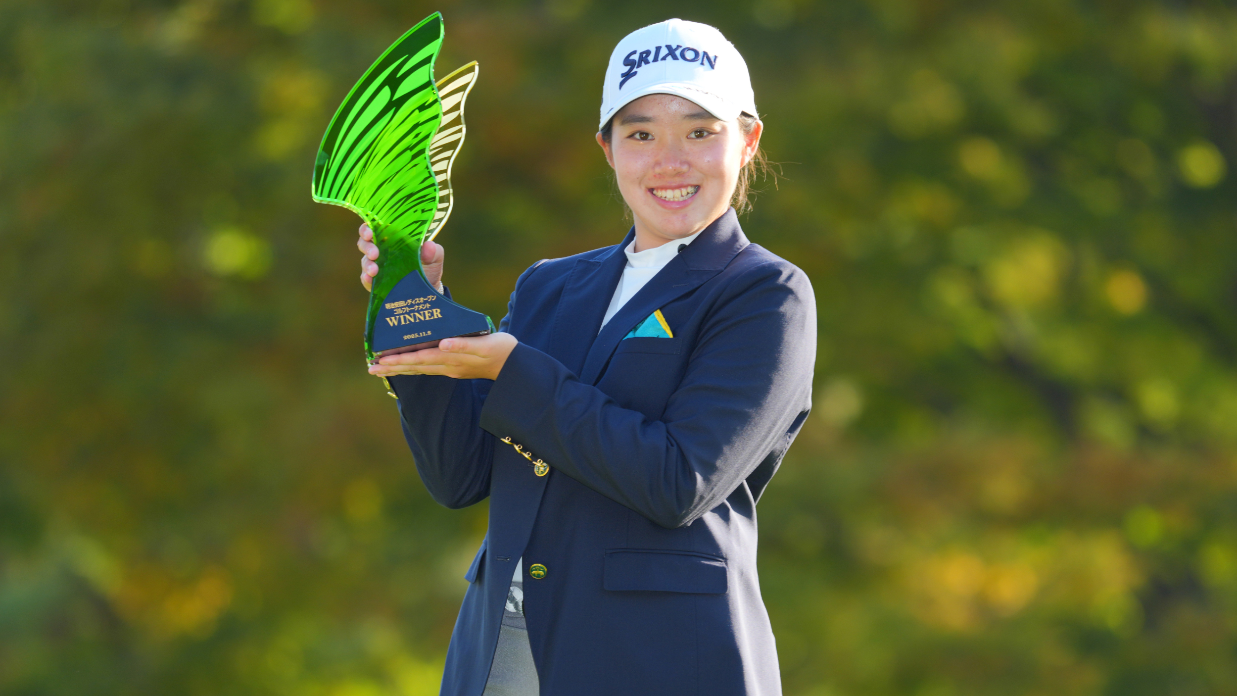 Anna Iwanaga with the Meiji Yasuda Ladies Open Golf Tournament trophy