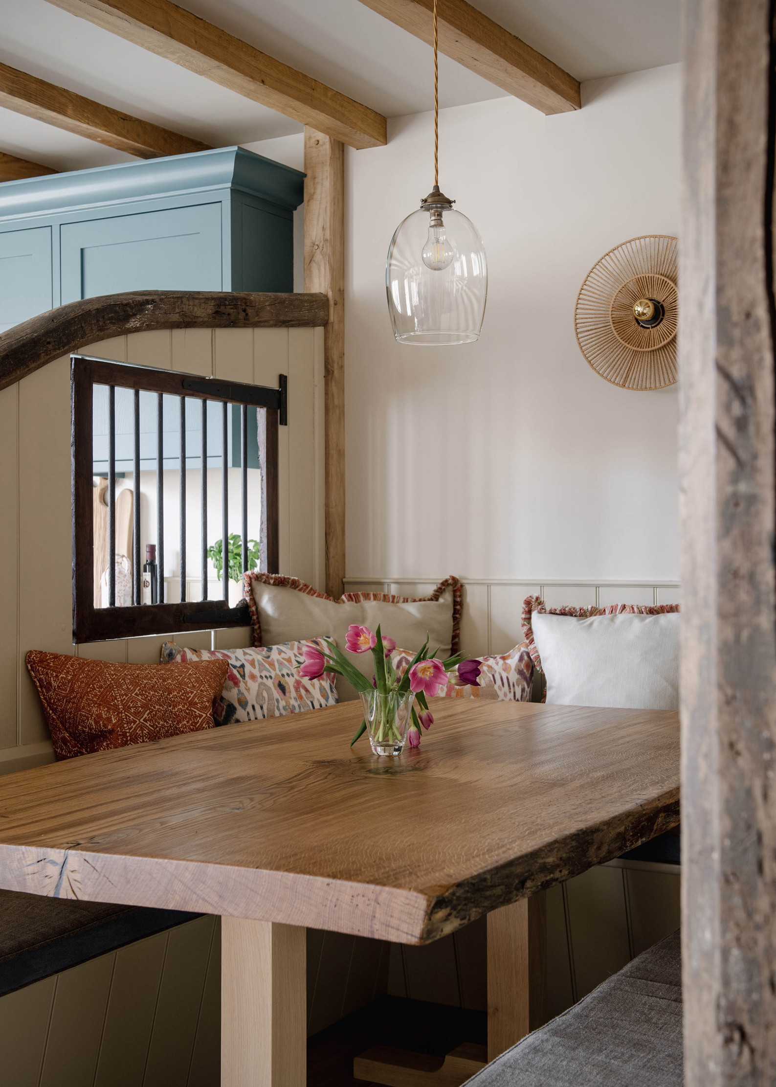 The farmhouse style interior of Monxton, with blues, reds, and natural wood finishes throughout.
