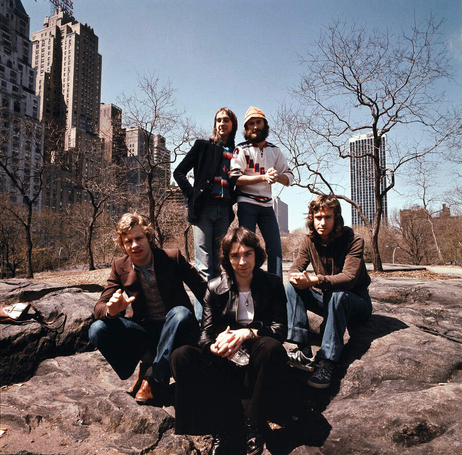 Drummer Bill Bruford, bassist Mike Rutherford, guitarist Steve Hackett, singer Phil Collins and keyboard player Tony Banks in Central Park, New York City in April 1976