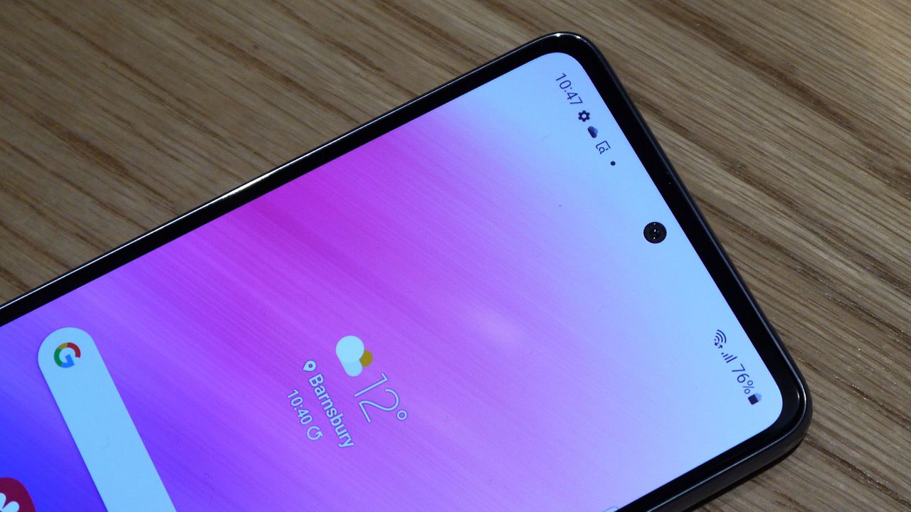 Top portion on a smartphone screen showing notification bar and selfie camera