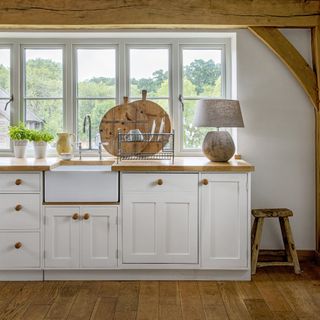 Country kitchen with cream cabinetry and wooden floors