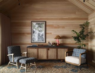 Seating area with wooden walls, wood sideboard and mid century-style wood furniture