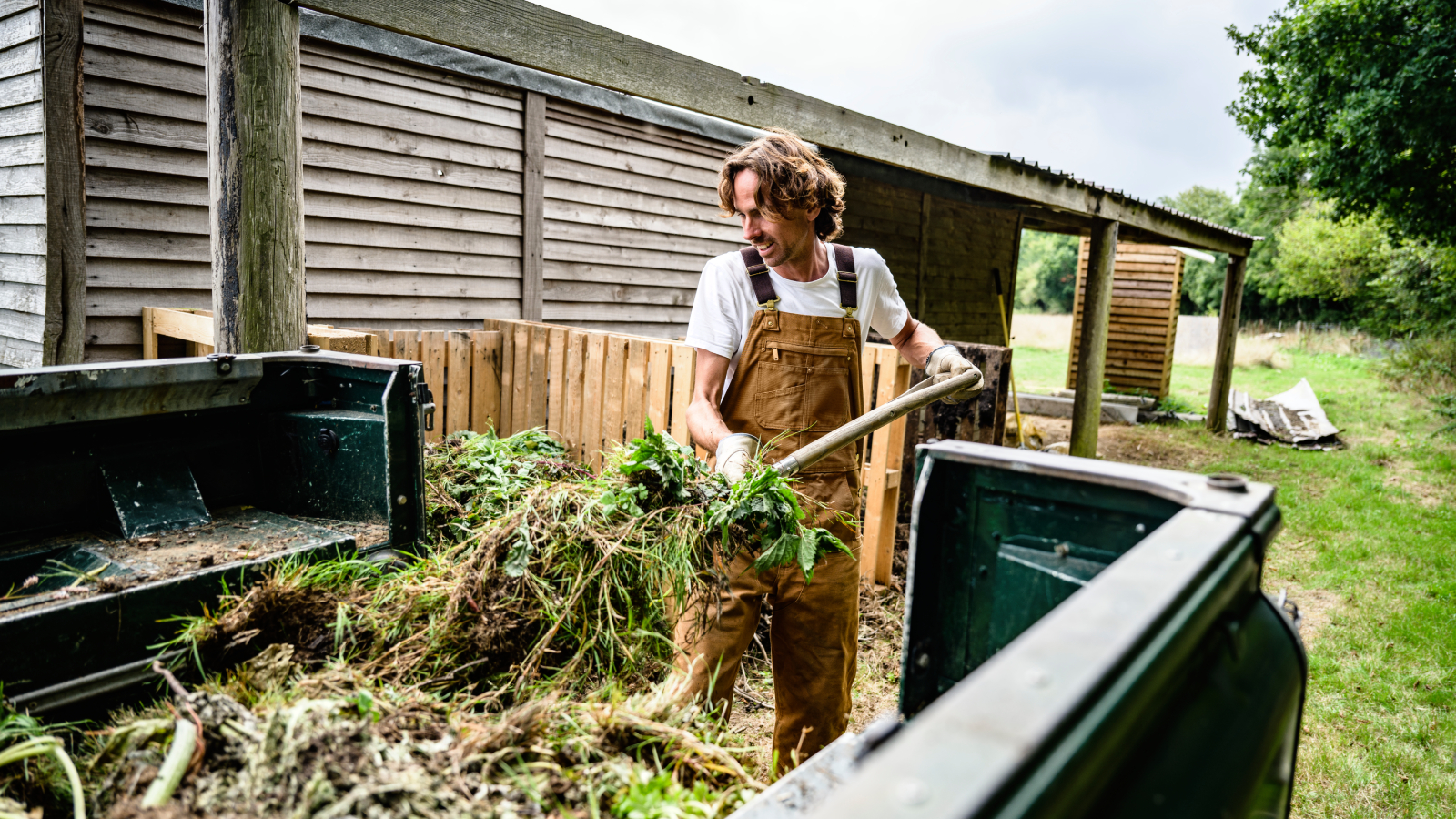 Man unloading composting greens and browns from truck