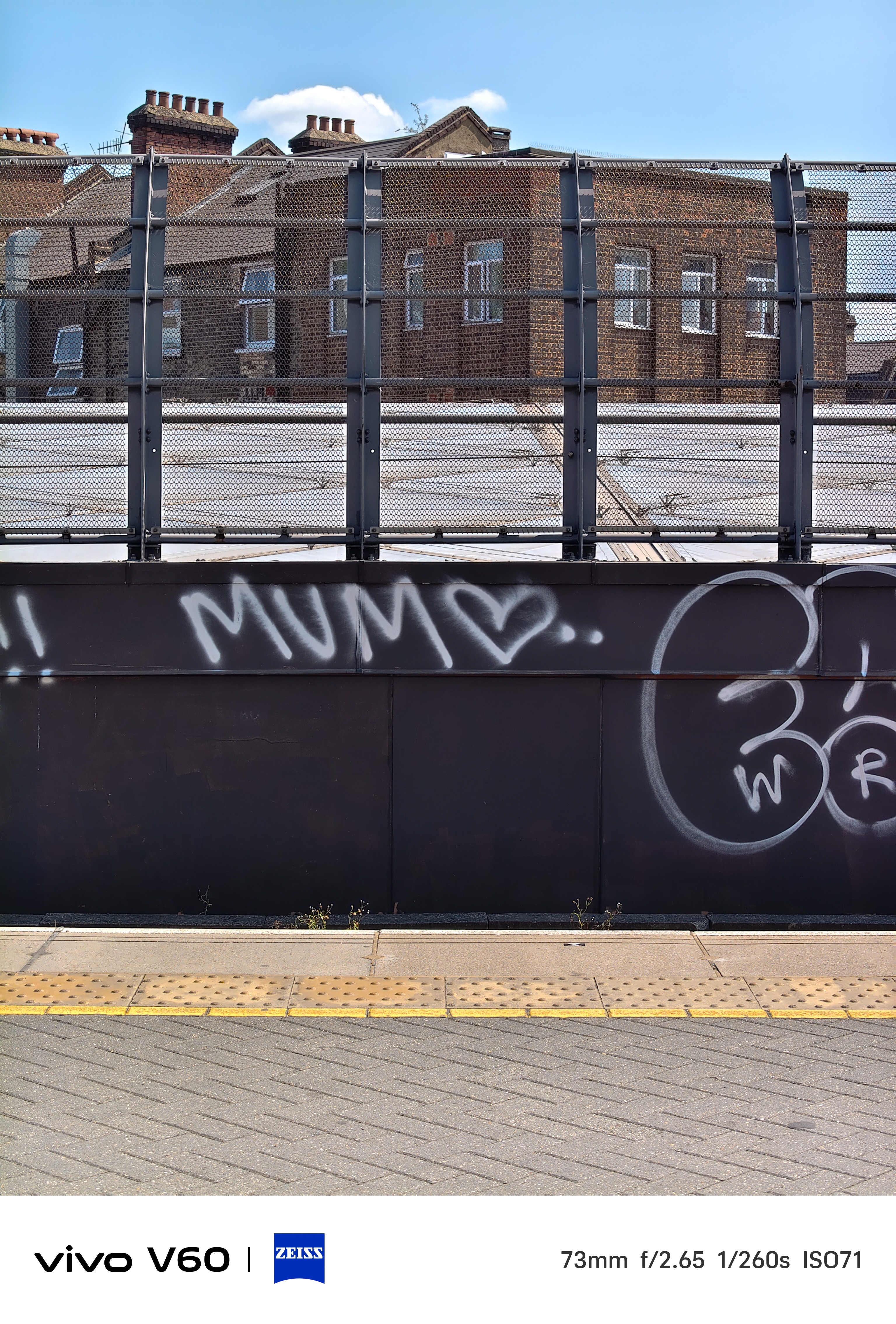 Graffiti on a train track reading mum