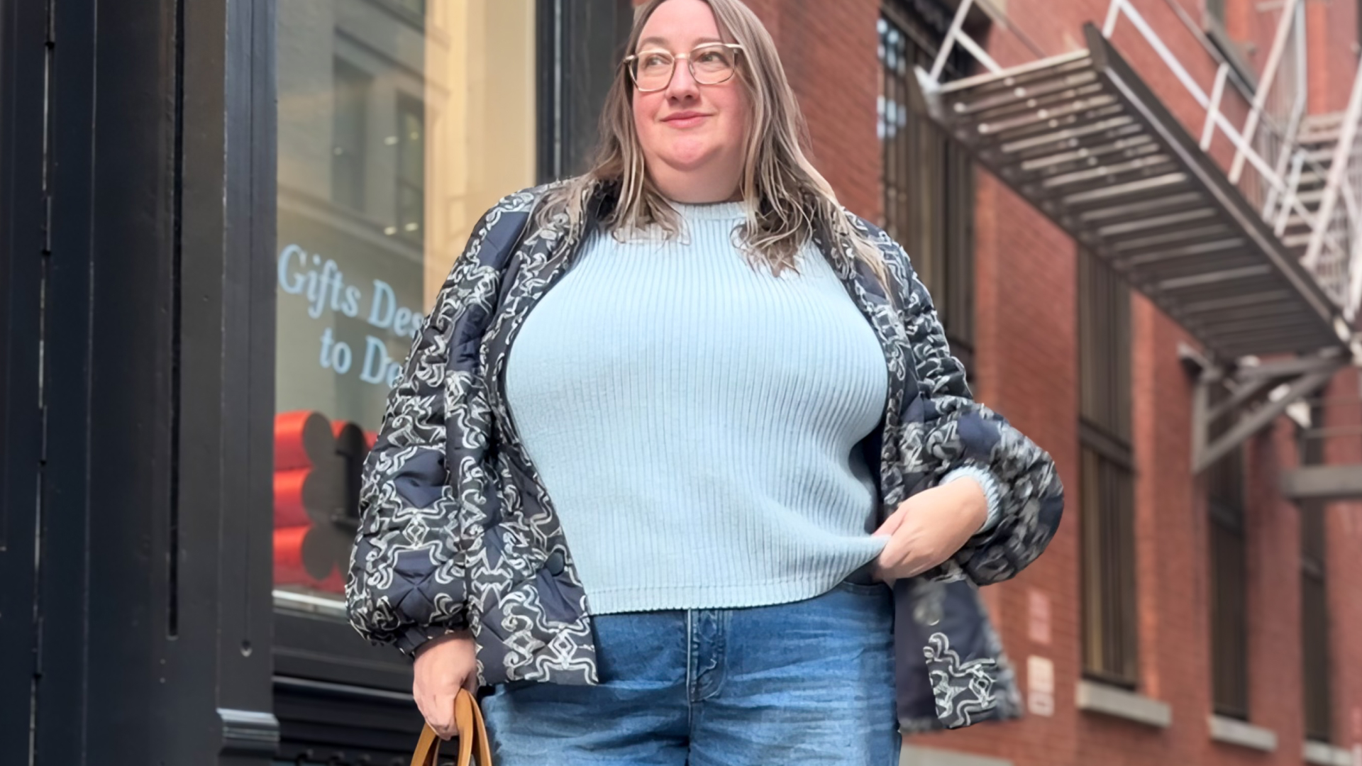 Sarah Chiwaya wearing a sweater