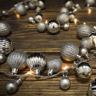 Christmas lights in the style of lit silver baubles