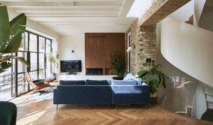 living room with blue L-shaped sofa