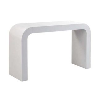 a white curved console table