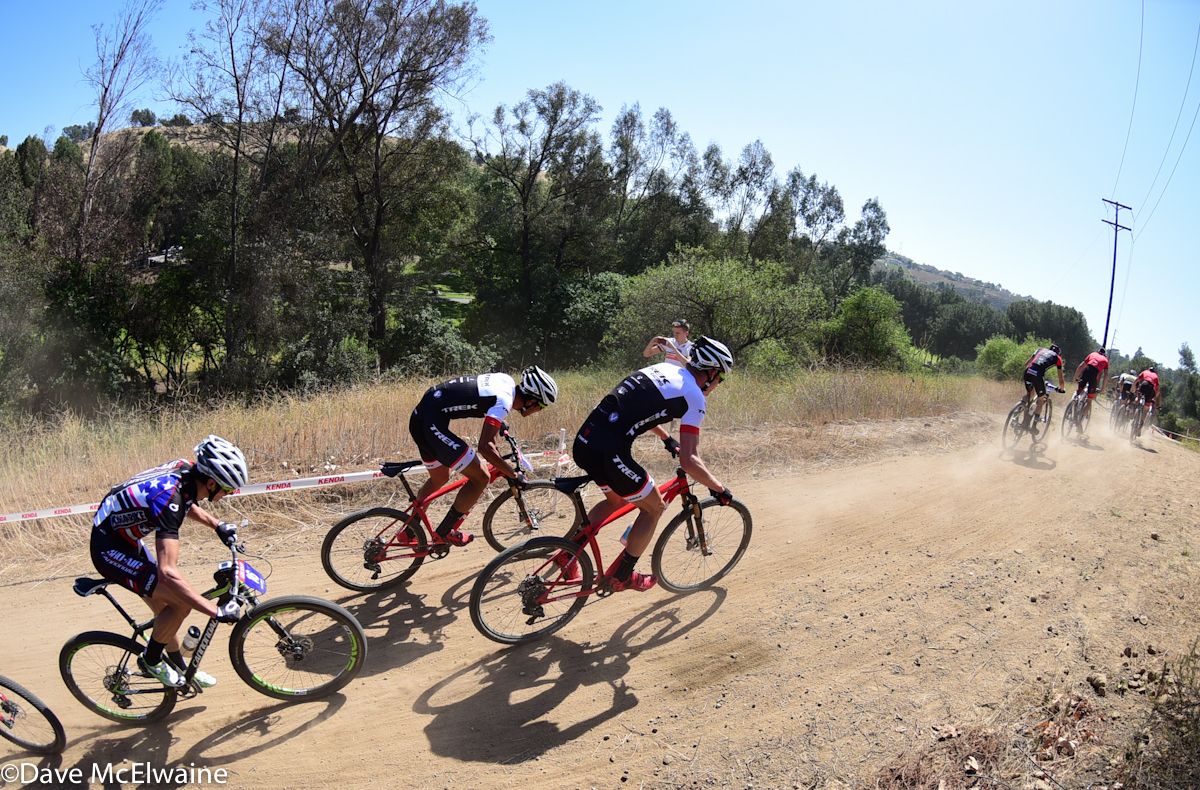 A split took place in the peloton on lap four.